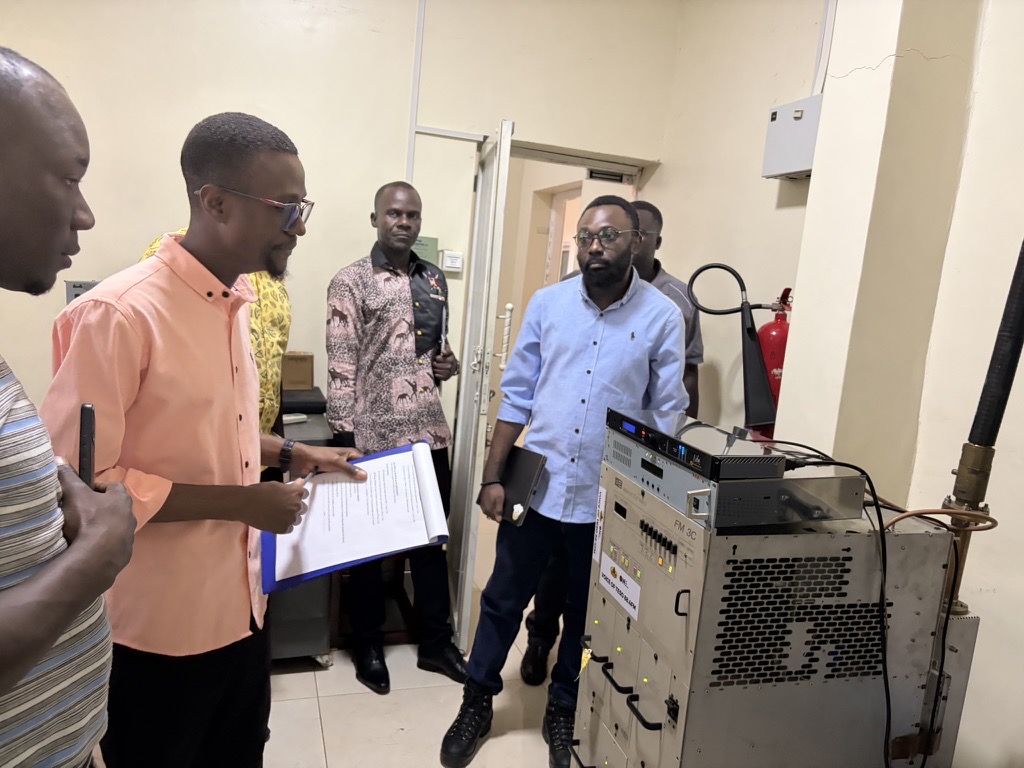 Neuravox team and station engineers beside the FM transmitter at Voice of Teso in Soroti, Uganda